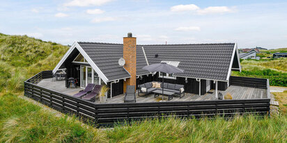Ferienhaus mit geschlossener Terrasse in den Dünen